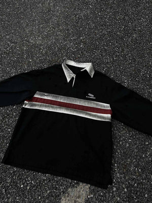 Distressed Long Sleeve Rugby Shirt in Black – flat lay on asphalt | XoKool