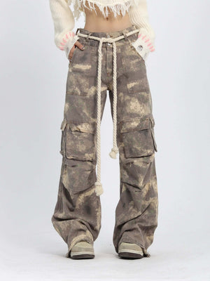 Embrace laid-back utility with the Camo Baggy Wide Leg Pockets Cargo Pants — a functional staple with bold streetwear appeal. Made from a breathable cotton blend, these relaxed-fit pants feature a drawstring waistband for customizable comfort and multiple