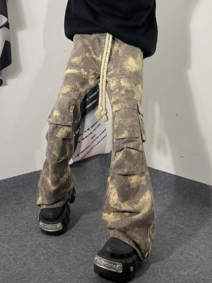 Embrace laid-back utility with the Camo Baggy Wide Leg Pockets Cargo Pants — a functional staple with bold streetwear appeal. Made from a breathable cotton blend, these relaxed-fit pants feature a drawstring waistband for customizable comfort and multiple