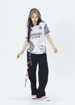 Show off your love for Real Madrid and Hello Kitty with our Dragon Jersey! Made with high-quality materials for maximum comfort and durability. Perfect for any fan or collector, this jersey showcases unique design elements that make it truly one-of-a-kind
