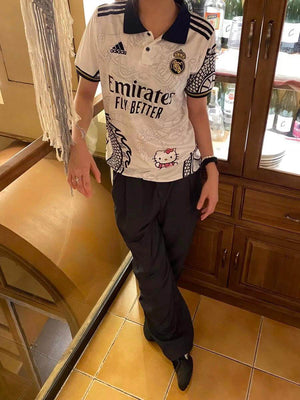 Show off your love for Real Madrid and Hello Kitty with our Dragon Jersey! Made with high-quality materials for maximum comfort and durability. Perfect for any fan or collector, this jersey showcases unique design elements that make it truly one-of-a-kind
