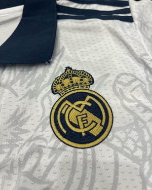 Show off your love for Real Madrid and Hello Kitty with our Dragon Jersey! Made with high-quality materials for maximum comfort and durability. Perfect for any fan or collector, this jersey showcases unique design elements that make it truly one-of-a-kind