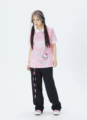 Show off your love for Real Madrid and Hello Kitty with our Dragon Jersey! Made with high-quality materials for maximum comfort and durability. Perfect for any fan or collector, this jersey showcases unique design elements that make it truly one-of-a-kind