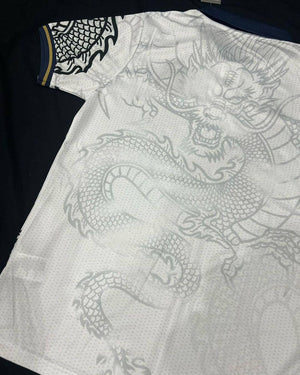 Show off your love for Real Madrid and Hello Kitty with our Dragon Jersey! Made with high-quality materials for maximum comfort and durability. Perfect for any fan or collector, this jersey showcases unique design elements that make it truly one-of-a-kind