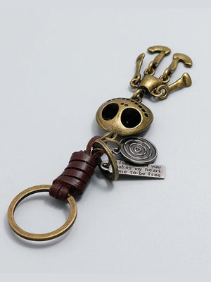 Totenkopf-Schlüsselanhänger in Antik-Bronze mit Lederschlaufe – Produkt flach, Rückseite | XoKool
