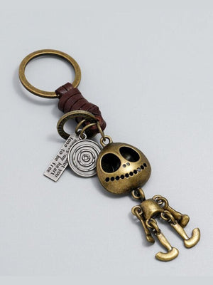 Totenkopf-Schlüsselanhänger in Antik-Bronze mit Lederschlaufe – Produkt flach | XoKool