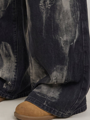 Bleached black grommet jeans – hem/fade close-up on model | XoKool