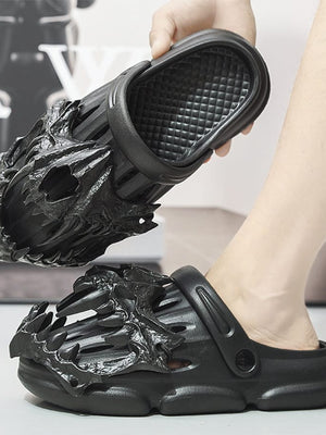Black Gothic Clogs with Sculpted Claw Upper – Hand holding clog, worn, side view | XoKool