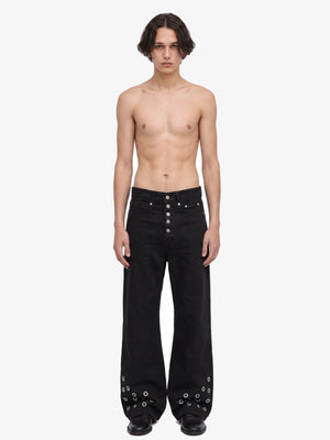 Black Grommet Jeans with Button Fly – on model, front | XoKool