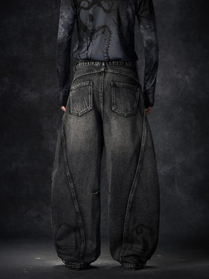 Black Ripped Barrel Jeans with Gothic Letter Patches – on model, back | XoKool