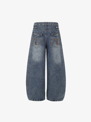 Blue Barrel Jeans with Studded Strap Tabs – back flat | XoKool