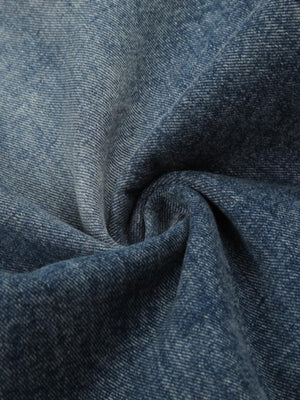 Studded strap barrel jeans – fabric swirl close-up | XoKool