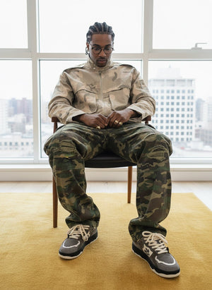 Ripped Camo Cargo Pants with Slight Flare – on model, seated | XoKool