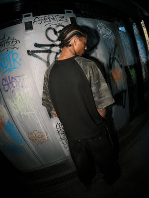 Camo Sleeve Raglan Tee with Distressed Face Graphic – Street photo, on model, back | XoKool