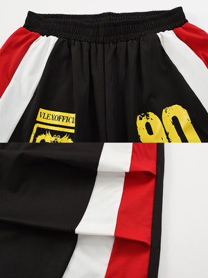 Colorblock track pants – Black waistband, crest print and side panel close-up | XoKool