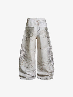 Jeans crema con estrella de tachas y salpicaduras de pintura – vista trasera en plano | XoKool