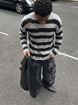 Distressed Black and Grey Striped Knit Sweater – street photo on model | XoKool