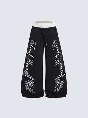 Pantalones deportivos de pierna ancha con doble cintura y estampado de letras – negro, vista frontal | XoKool