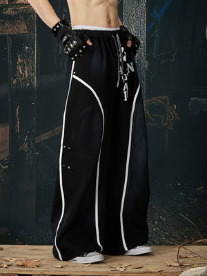 Piping sweatpants – Black, on model angled close | XoKool