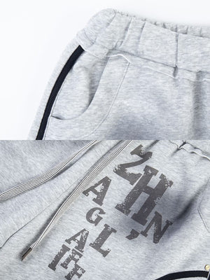 Piping sweatpants – Grey waistband and print close-up | XoKool