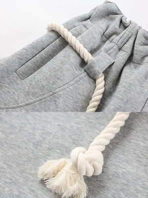 Grey barrel sweatpants – Grey pocket and rope knot close-up | XoKool