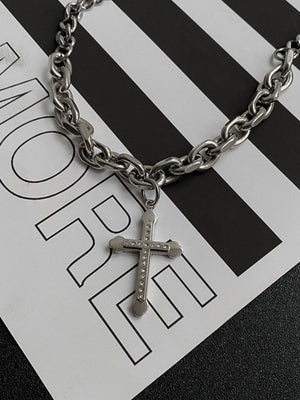Gothic Cross Necklace on Chunky Chain – styled on striped print backdrop | XoKool