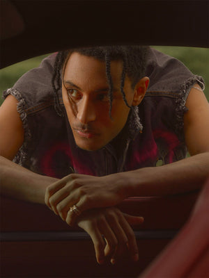 Spray Paint Heart Denim Vest – Washed Black, on model close-up in car | XoKool
