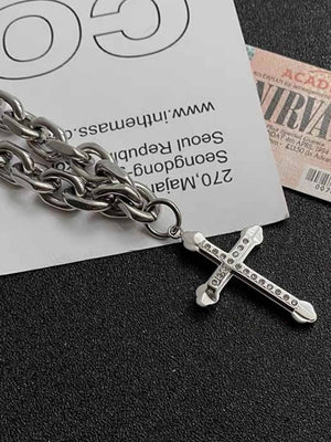 Gothic Cross Necklace on Chunky Chain – cross pendant close-up with props | XoKool