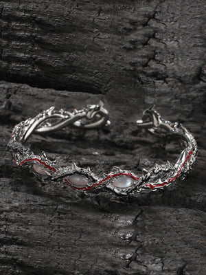 Thorn Cuff Bracelet with Pink Stones – on dark wood backdrop | XoKool