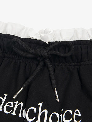 Shorts deportivos con doble cintura y volantes – detalle de la cintura con volantes y el cordón | XoKool