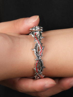 Thorn bracelet – on wrist held in hand | XoKool