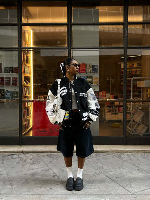 Black and White Varsity Jacket with Chenille Patches – street photo, front on model (duplicate) | XoKool