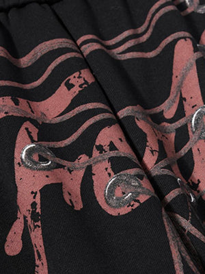 Lace-up sweatpants – print and eyelets close-up | XoKool