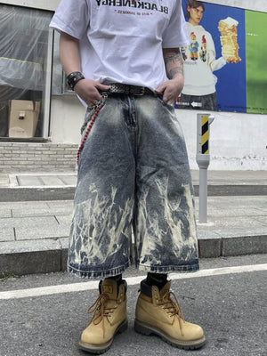 Long Baggy Jorts with Bleached Flame Wash – on model, front, street | XoKool