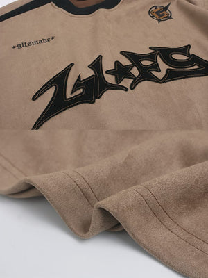 Moto long sleeve shirt – Tan appliqué and hem close-up | XoKool