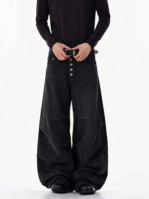 Pleated Button Fly Barrel Jeans – Black on model, front | XoKool