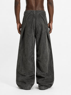 Pleated Grey Baggy Jeans with Star Buttons – Washed Charcoal on model, back | XoKool