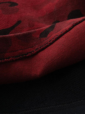 Red camo pants – Raw hem over black layer close-up | XoKool
