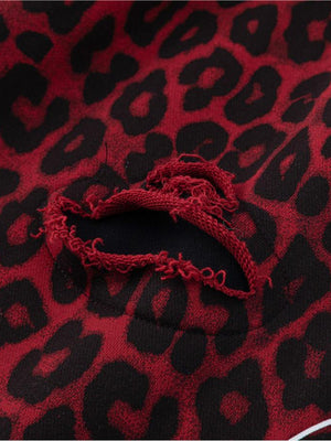 Leopard sweatpants – Ripped hole close-up | XoKool