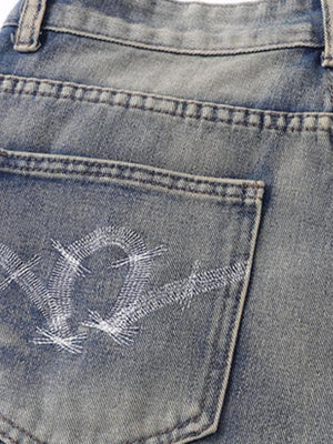 Camo patchwork jeans – back pocket embroidery close-up | XoKool