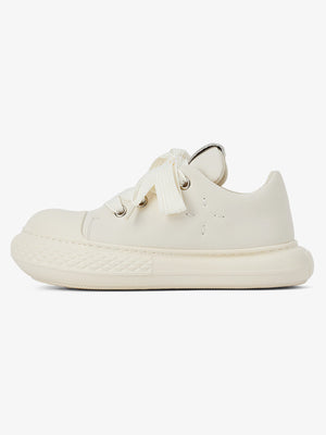 Zapatillas chunky big toe con suela redondeada – Crema, vista lateral | XoKool