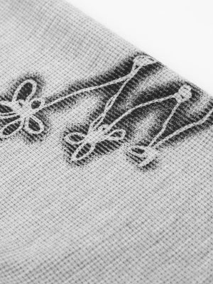 Waffelstrick-Longsleeve – Nahaufnahme des Prints am Bündchen | XoKool