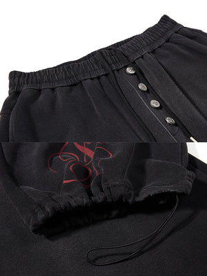 Bestickte Jogginghose – Schwarz, Knopfleiste und Saumkordel im Detail | XoKool