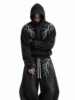 Washed Black Lightning Bolt Cropped Hoodie – On model, arms crossed, front | XoKool