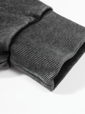 Sudadera cuello redondo negro lavado – detalle del puño acanalado | XoKool