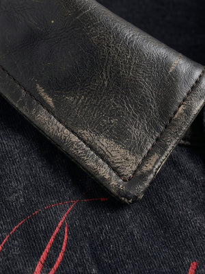 Washed black polo shirt – leather-look collar close-up | XoKool
