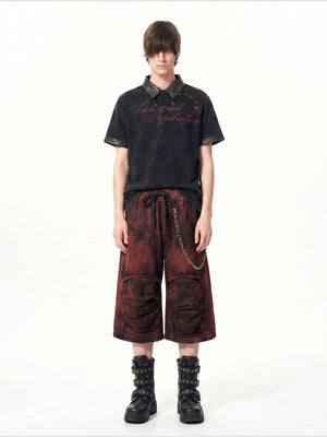 Washed Black Polo Shirt with Red Script Print – on model, front | XoKool