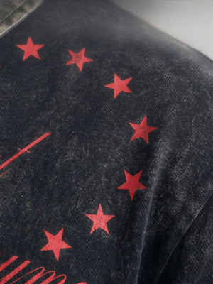 Washed black polo shirt – star print close-up | XoKool