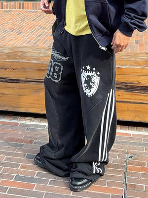 Washed Black Side Stripe Varsity Sweatpants – On model, street, front | XoKool