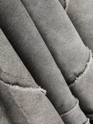Chaqueta acolchada patchwork – detalle de textura de los pliegues de la tela | XoKool